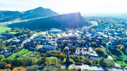 Aerial image from above Calton Hill with view to Arthurs Seat, Salisbury Crags, Holyrood Palace and the Scottish Parliament.