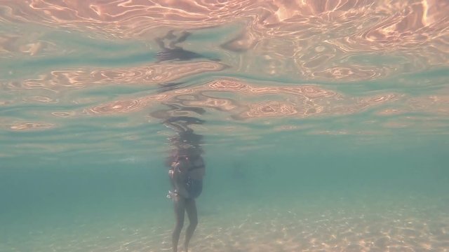 girls in thong play underwater