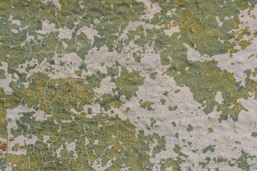 texture of old concrete wall with cracked paint close-up