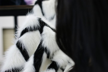 Modeler. Dressmaker. Modeling fur coats. Eco fur.