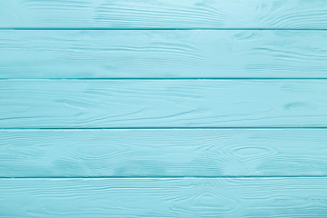 Light blue plank texture of wood table. Coloured background.