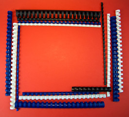 color plastic binding spring frame on red background