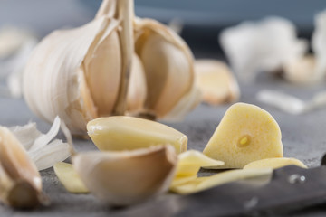Garlic heads close-up on grey background. Condiment.
