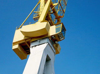 Yellow port crane in the port. 