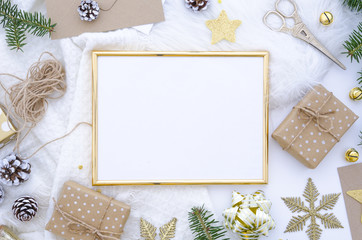 Christmas golden frame mock up made of christmas decoration, balls, cones, golden star, gift box...