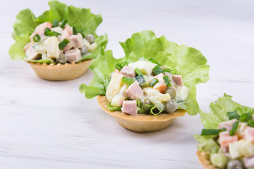 Traditional russian salad Olivier in tartlet