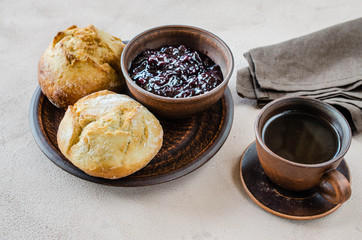 Simple breakfast: coffee americano, fresh buns and jam.