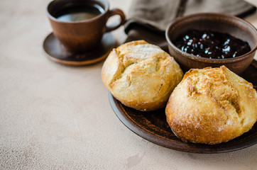 Simple breakfast: coffee americano, fresh buns and jam.