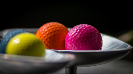 Isolated colorful golf balls