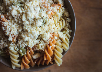 Tri color fusilli with cheese with dill