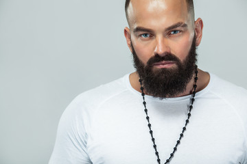 Close-up portrait of a brutal bearded man