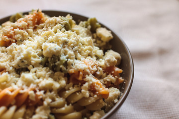 Tri color fusilli with cheese with dill
