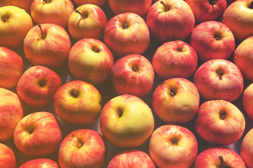 Many red and yellow apples, colorful background