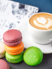 French colored pasta and a cup of cappuccino