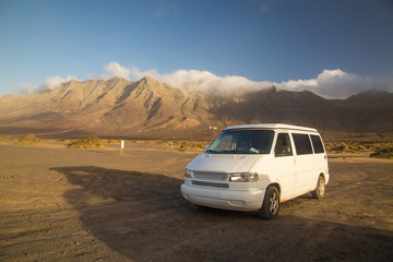Fototapeta na wymiar Camper van parked on Cofete beach in Fuerteventura.