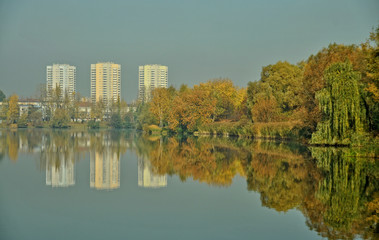 Green Katowice city - buildings and lake in Valley of Three Ponds