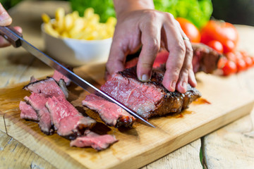 Beef steak cut on chopping board