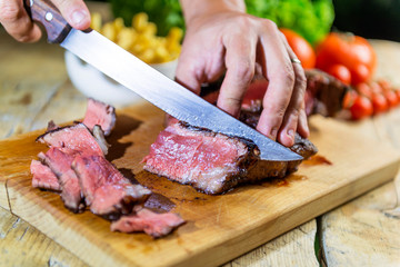 Beef steak cut on chopping board