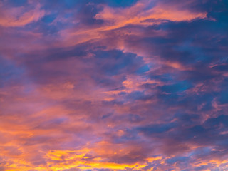 Naklejka na ściany i meble Colorful, dramatic clouds at sunset