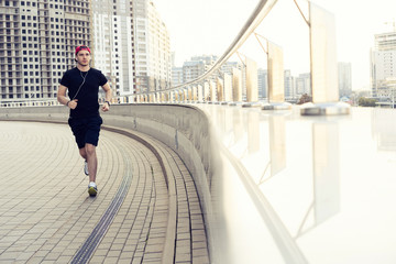 Fit athlete running outdoors to stay healthy
