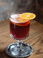 red mulled wine decorated with dryed orange on the table in the bar