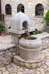 Old water fountain inside the monastery of Saint Naum, Ohrid Macedonia