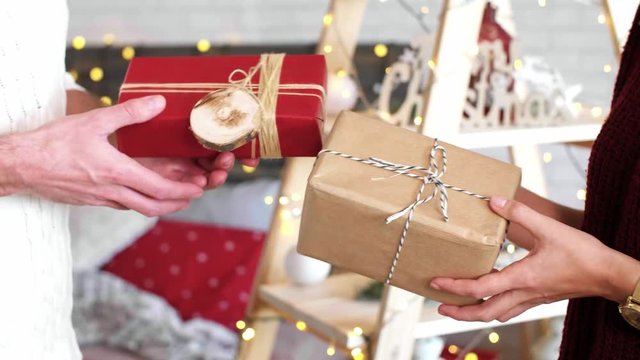 Couple exchanging their christmas presents