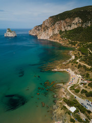 Beach landscape. Emerald green sea water and rocks on coast of Sardinia, Italy.
