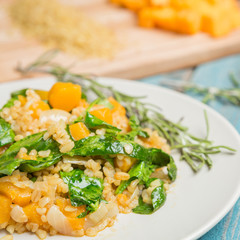 Bulgur with pumpkin and cutting board with ingredients