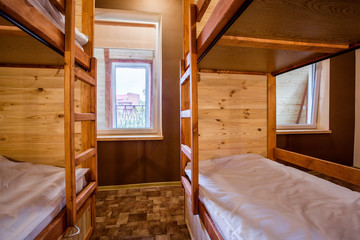 Bunk wooden beds in the comfortable hostel