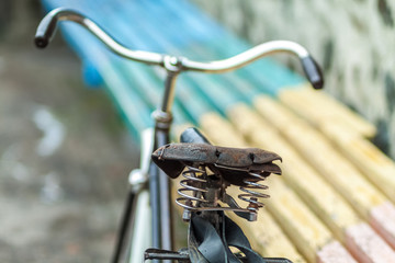 An old bicycle seat with a spring shock absorber.