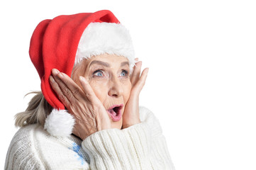Portrait of senior woman in Santa hat