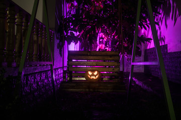 Fototapeta na wymiar Halloween pumpkin. Carved Halloween pumpkin glowing in the dark.
