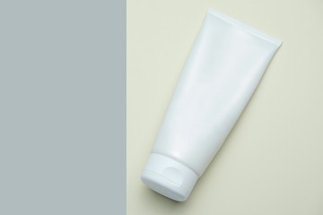 White Cosmetic Tube Pack Of Cream, Gel Or Lotion. Empty Blank Pastel Colors Minimal Style Flat Lay With Space For Text. Branding Mock-up Concept Of Beauty Product