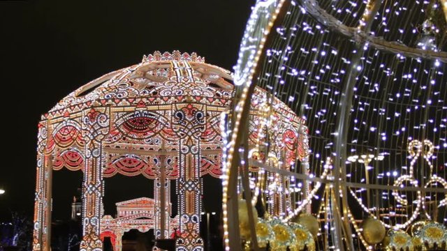 Teatralnaya Square in Moscow city center decorated for Christmas holidays. Bolshoi Theatre and illuminated ornamental pavilion.