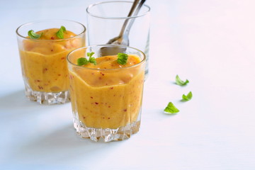 Peach slush with mint in glasses,  copy space