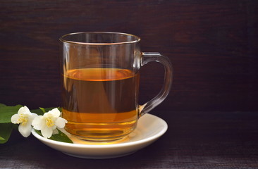 Green tea with jasmine blossom, copy space