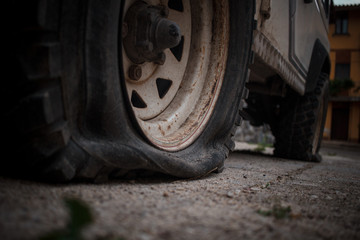 deflated wheel, laundry wheel. Old jeep 4x4.