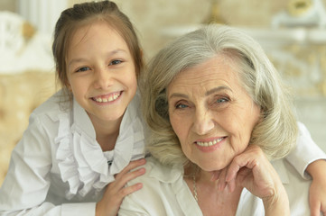 Portrait of a happy grandmother and granddaughter