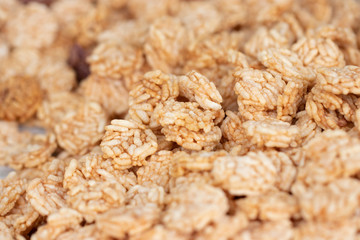 Rice Craker made from rice and then fried with oil until crisp. Fragrant and delicious. Soft focus and blur. (Khao Tan)