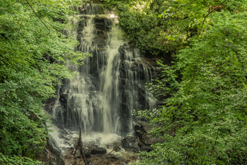 Great Smoky Mountains Expressway, Cherokee, North Carolina - June 19, 2018: Waterfall in the interior of a forest in Great Smoky Mountains