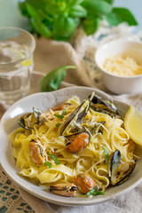 Tagliatelle pasta with mussels in creamy sauce