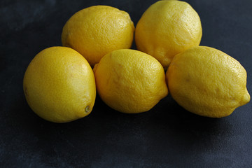 Lemon on dark board, high angle view