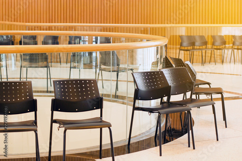 Row Of Blank Black Color Chair And Wood Background Stock