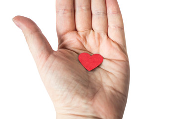 Concept of red heart sign held in hand on white background. Top view, clipping path. Metaphor to...