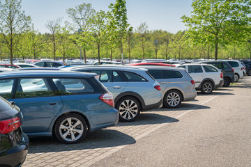 row of cars in parking lot