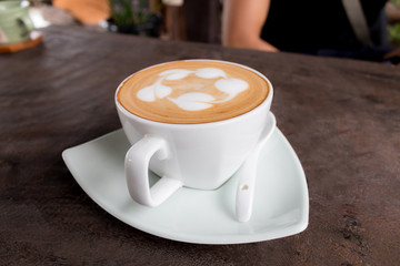 Cup of coffee hot on wooden table.