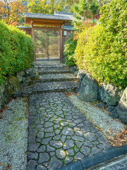 Obraz premium Entrance with cobblestone pathway in Japanese style