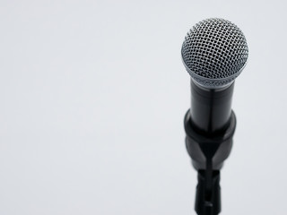 Microphone on stand at white background