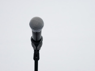 Wireless microphone on stand at white background